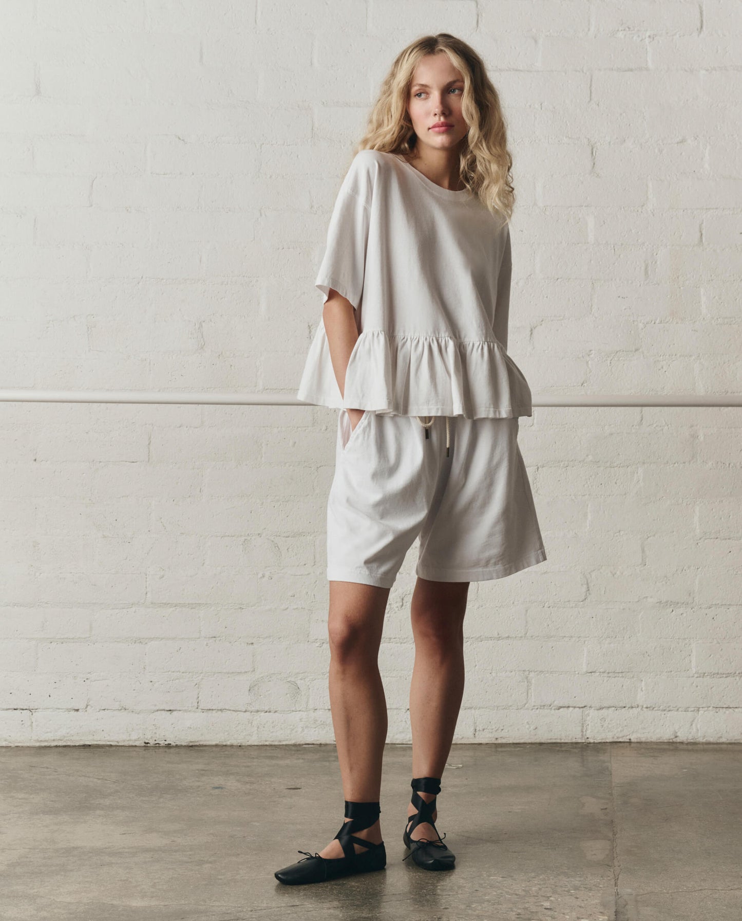 The Oversized Ruffle Peplum Tee. -- True White