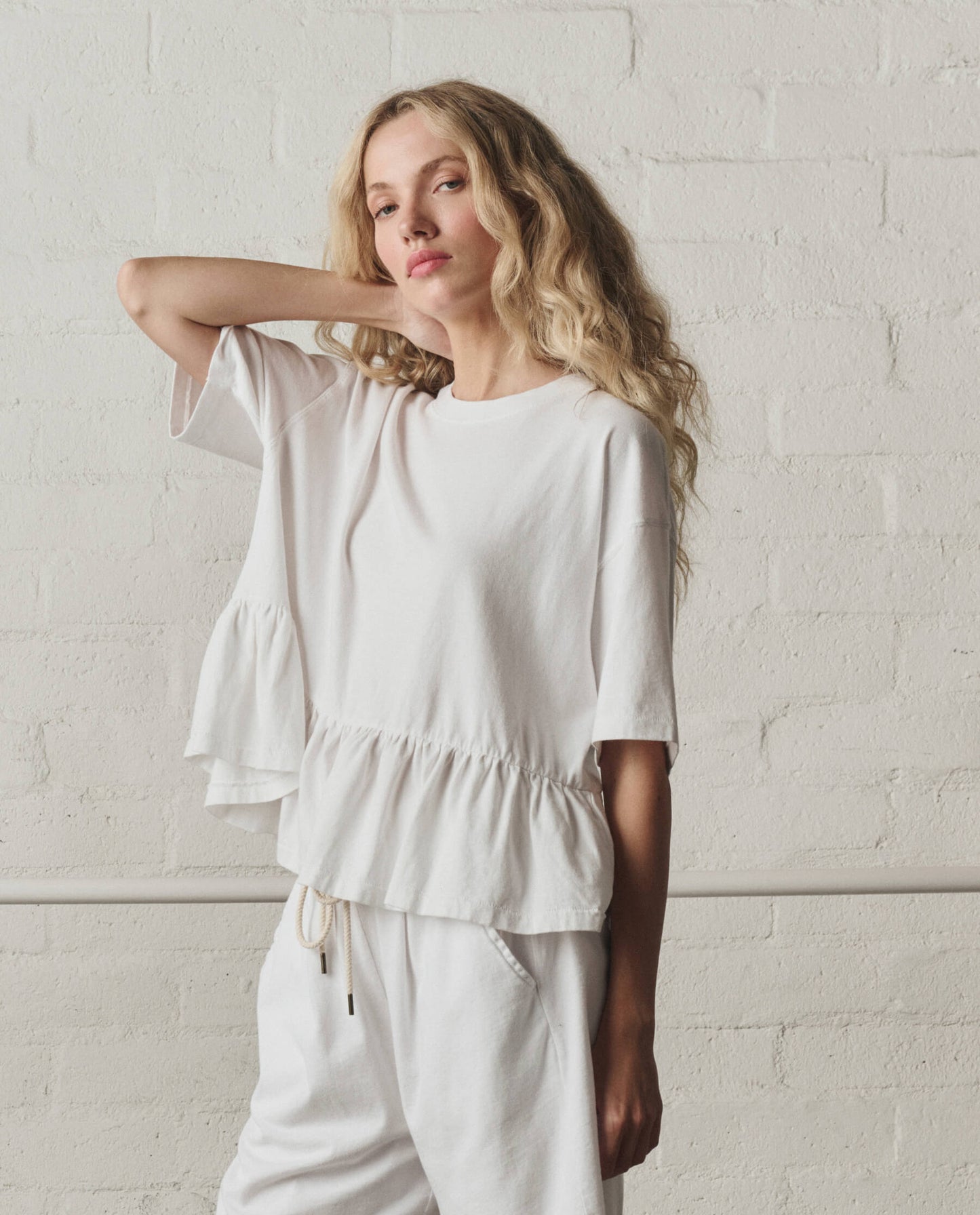 The Oversized Ruffle Peplum Tee. -- True White