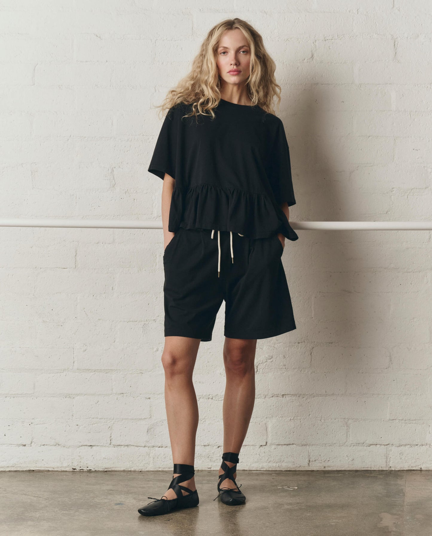The Oversized Ruffle Peplum Tee. -- True Black